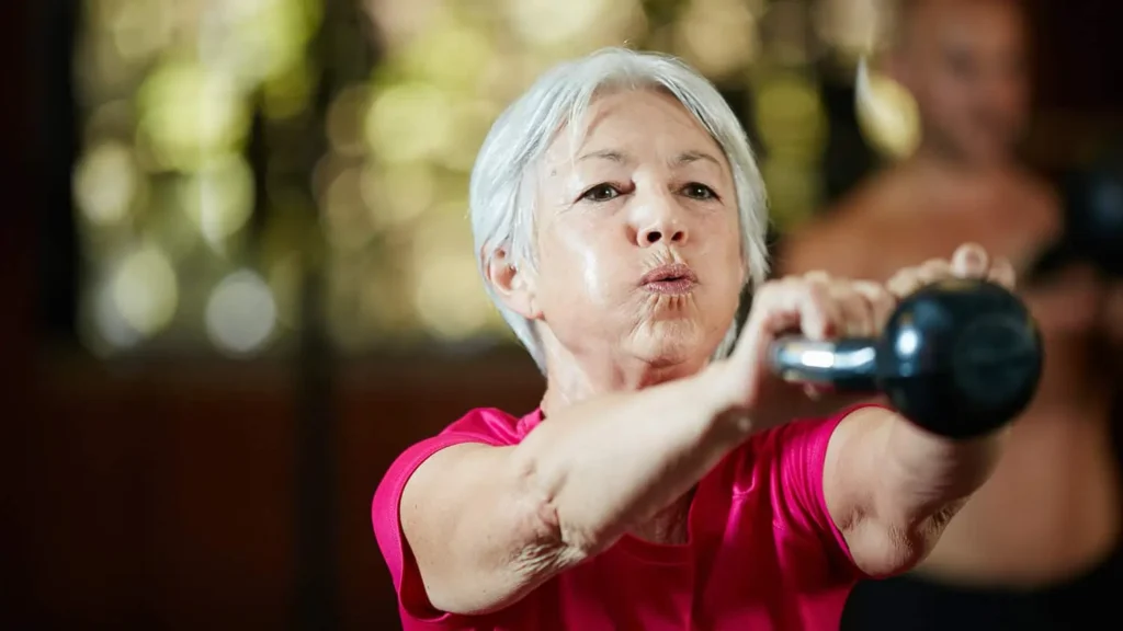 Toning Bingo Wings: Effective Exercises and Tips for Achieving Sleeker Arms 2 Person performing arm exercises with dumbbells Yorkshire