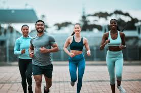 Sculpting Sleek Arms: The Essential Role of Cardio in Toning Without Bulking Up 3 image of people running to incorporate cardio Yorkshire exercise into their life to help tone arms and body.