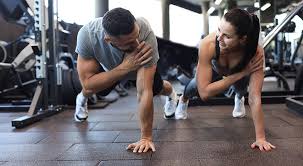 Image of man and woman doing Cardio Yorkshire to tone their arms. 